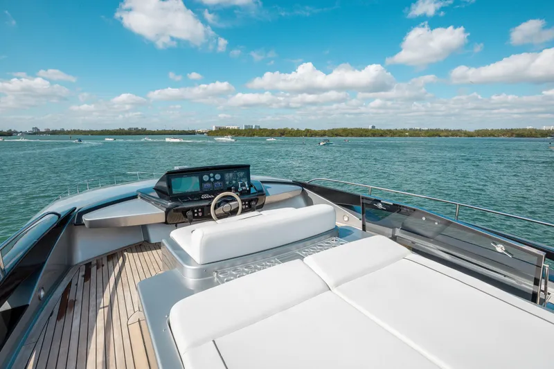 Slide: The Image of Luxurious 2014 Riva 86' DOMINO yacht with sleek deck and stunning ocean view. - 11