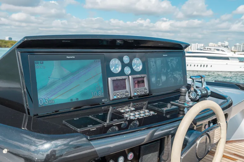 Slide: The Image of Control panel of 2014 Riva 86' DOMINO yacht with navigation screens and controls. - 12