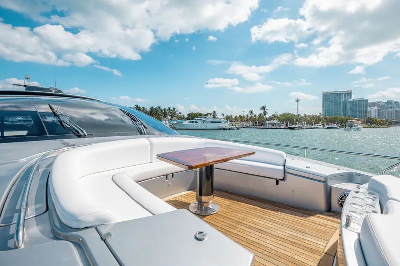 Slide: The Image of Luxurious 2014 Riva 86' DOMINO yacht with elegant deck seating and ocean view. - 15
