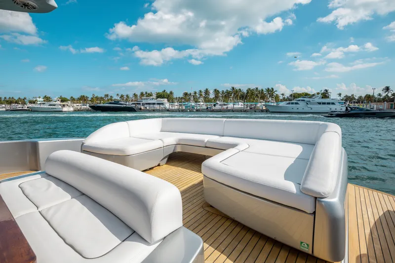 Slide: The Image of Luxurious 2014 Riva 86' DOMINO yacht with elegant white seating and scenic ocean view. - 17