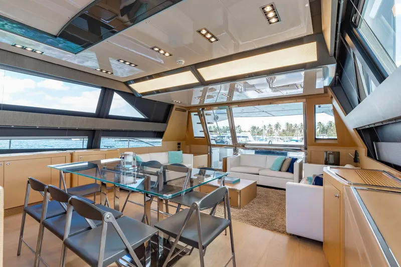 Slide: The Image of Luxurious interior of 2014 Riva 86' DOMINO yacht with modern furnishings and panoramic windows. - 26