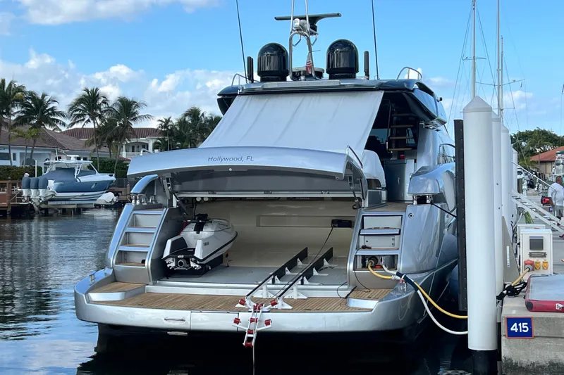 Slide: The Image of Luxury 2014 Riva 86' DOMINO yacht docked with jet ski in storage compartment. - 27
