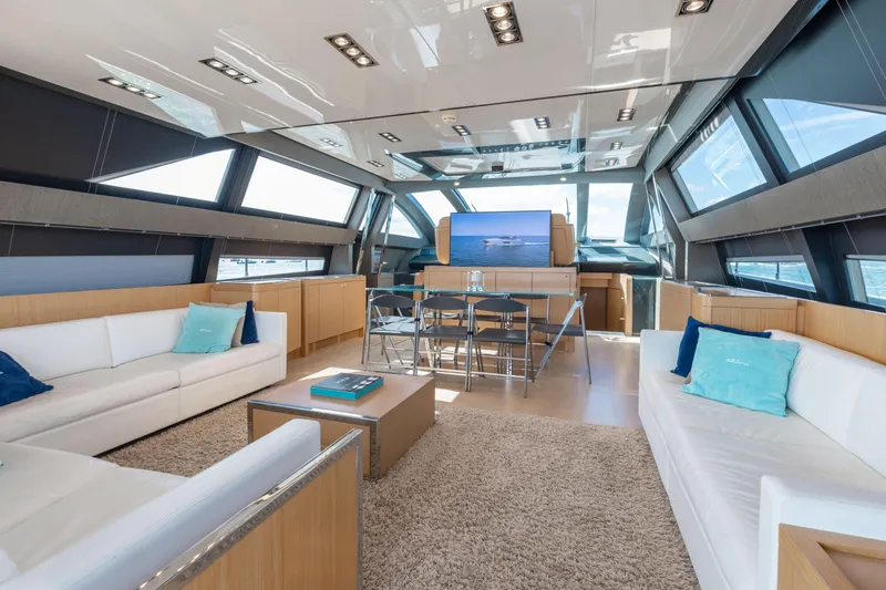 Slide: The Image of Luxurious interior of 2014 Riva 86' DOMINO yacht with modern furnishings and panoramic windows. - 29