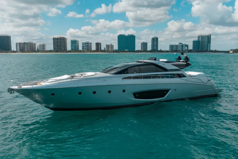 Slide: The Image of Luxurious 2014 Riva 86' DOMINO yacht cruising near city skyline. - 3