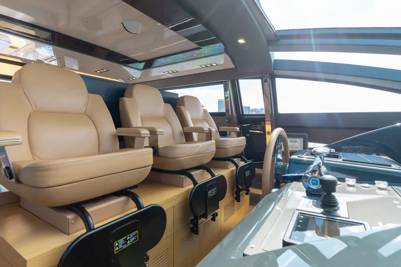 Slide: The Image of Luxurious interior of 2014 Riva 86' DOMINO yacht with leather seating and modern controls. - 31