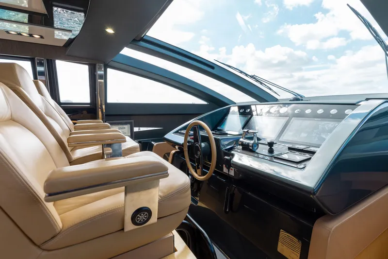 Slide: The Image of Luxurious interior of 2014 Riva 86' DOMINO yacht with modern helm and leather seating. - 32