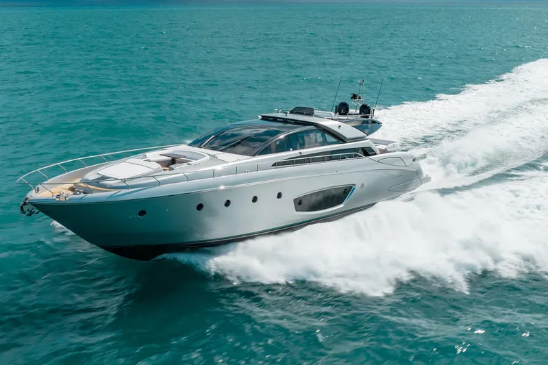 Slide: The Image of Luxurious 2014 Riva 86' DOMINO yacht cruising on turquoise waters. - 4