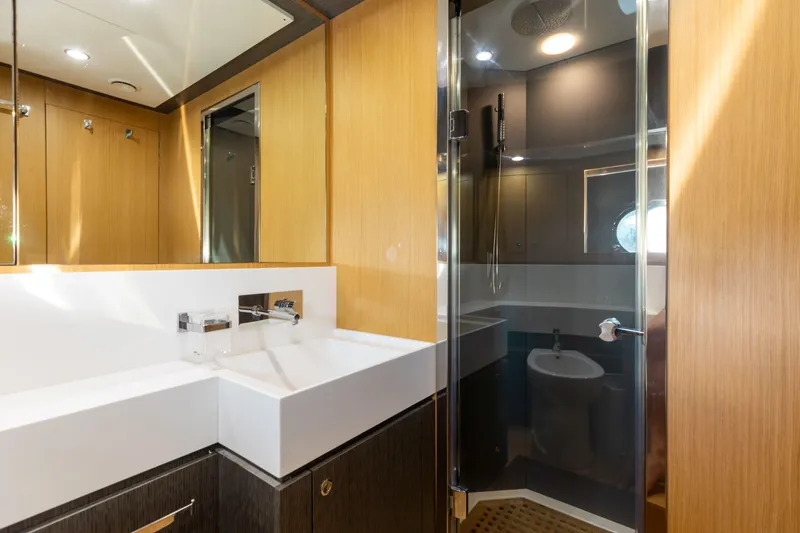 Slide: The Image of Luxurious bathroom on 2014 Riva 86' DOMINO yacht with modern fixtures and glass shower. - 41