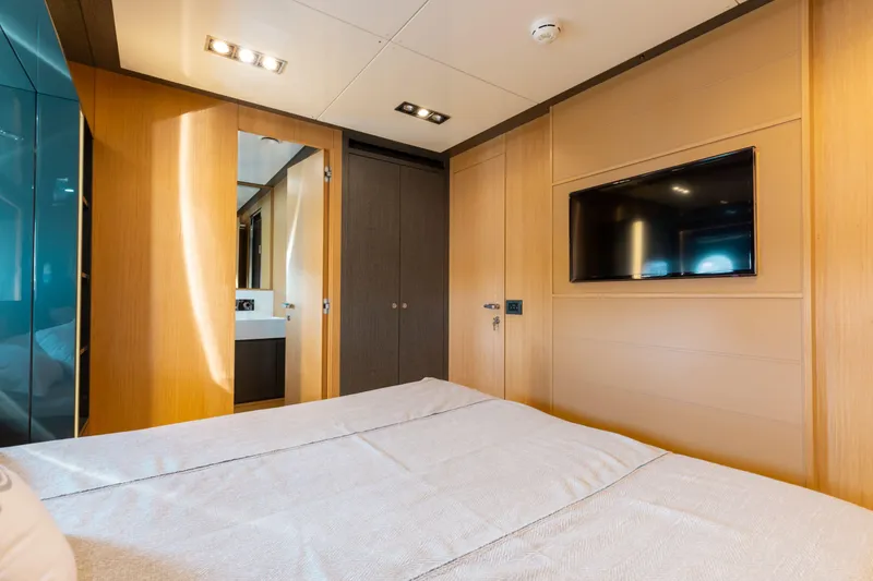 Slide: The Image of Luxurious bedroom interior on 2014 Riva 86' DOMINO yacht with modern design and TV. - 43