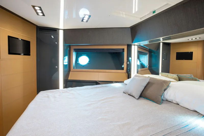 Slide: The Image of Luxurious bedroom interior of 2014 Riva 86' DOMINO yacht with modern design and porthole window. - 45