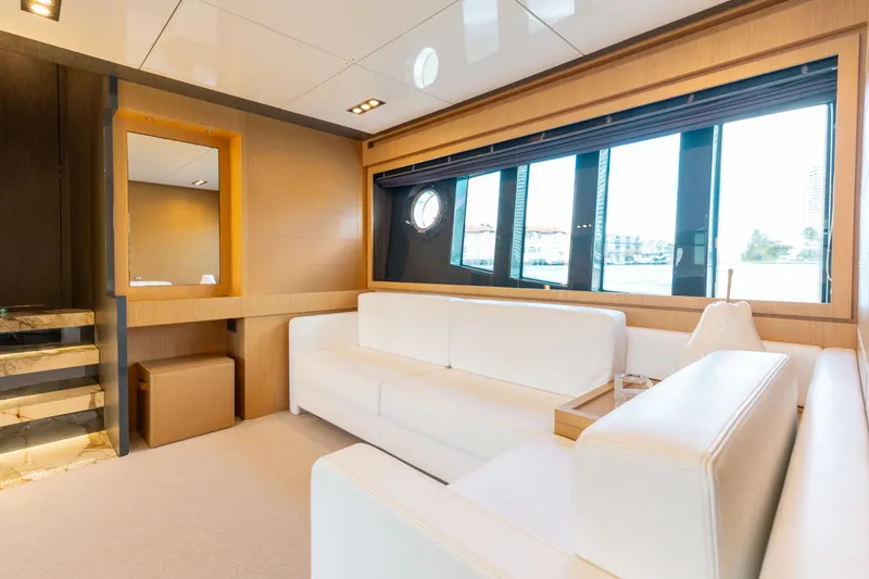 Slide: The Image of Luxurious interior of 2014 Riva 86' DOMINO yacht with white seating and large windows. - 53