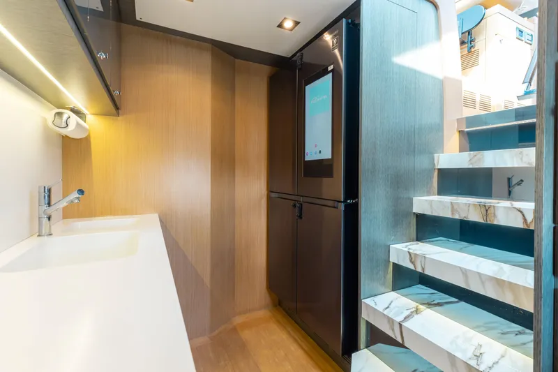 Slide: The Image of Luxurious interior of 2014 Riva 86' DOMINO yacht with modern kitchen and marble stairs. - 55