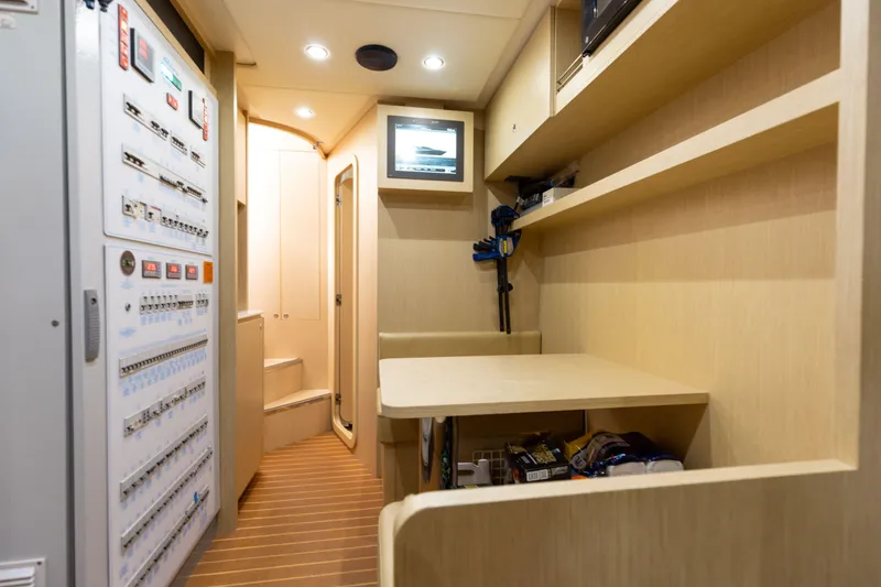 Slide: The Image of Interior of 2014 Riva 86' DOMINO yacht with control panel and workspace. - 60