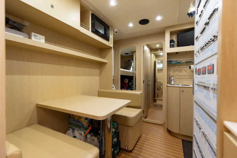 Slide: The Image of Luxurious interior of 2014 Riva 86' DOMINO yacht with modern amenities and wood finish. - 61