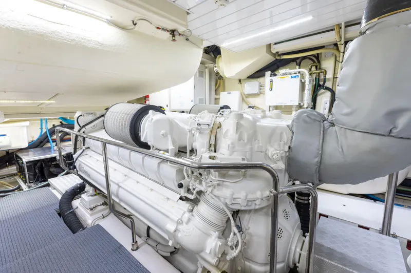 Slide: The Image of Engine room of 2014 Riva 86' DOMINO yacht, showcasing powerful machinery and equipment. - 68
