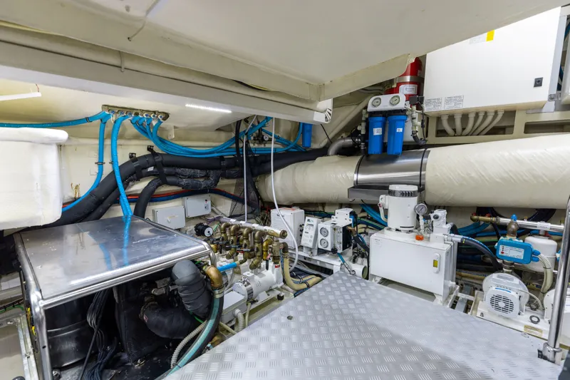 Slide: The Image of Engine room of 2014 Riva 86' DOMINO yacht with complex machinery and piping. - 74