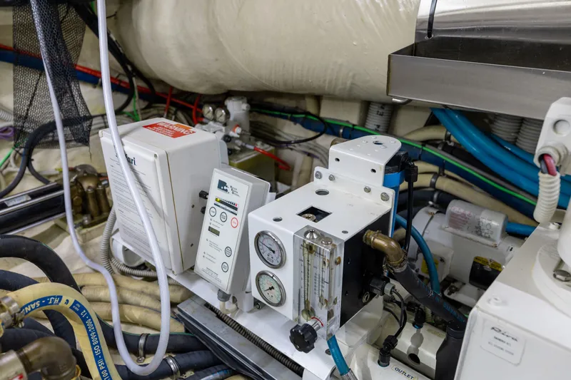 Slide: The Image of Engine room of 2014 Riva 86' DOMINO yacht with control panels and gauges. - 75