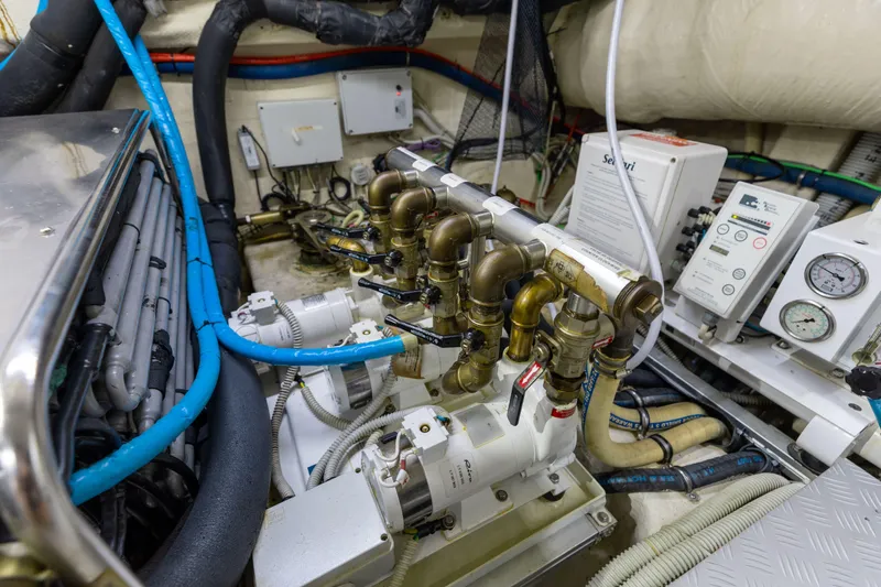 Slide: The Image of Engine room of 2014 Riva 86' DOMINO yacht with complex piping and control systems. - 76