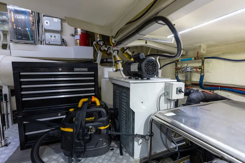 Slide: The Image of Engine room of 2014 Riva 86' DOMINO yacht with tools and equipment. - 77