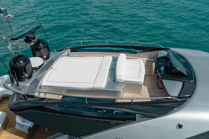 Slide: The Image of Luxurious 2014 Riva 86' DOMINO yacht deck with seating, overlooking the ocean. - 8