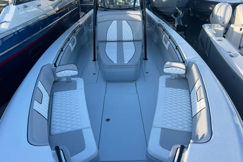 Slide: The Image of 2026 Contender 39 ST boat interior with white cushioned seating and sleek design. - 17