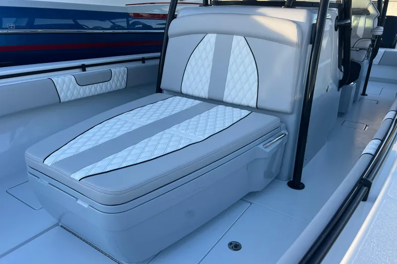 Slide: The Image of 2026 Contender 39 ST boat interior with white cushioned seating and sleek design. - 18