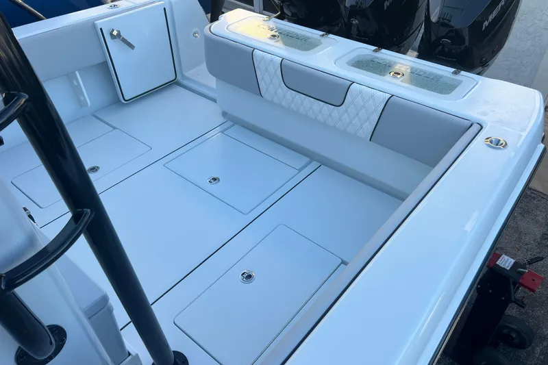 Slide: The Image of 2026 Contender 39 ST boat interior with storage compartments and seating. - 21