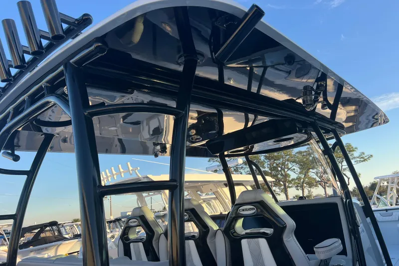 Slide: The Image of 2026 Contender 39 ST boat interior with sleek black framework and modern seating. - 25