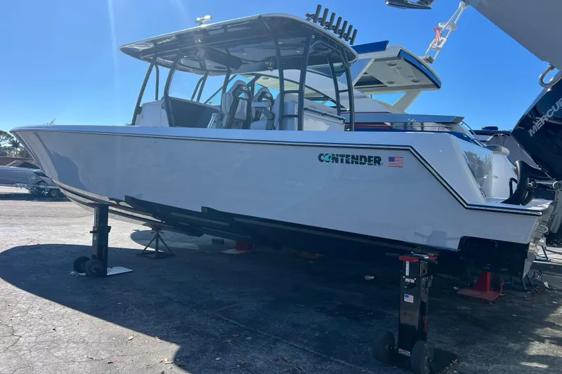 Slide: The Image of 2026 Contender 39 ST boat on display, showcasing sleek design and modern features. - 4
