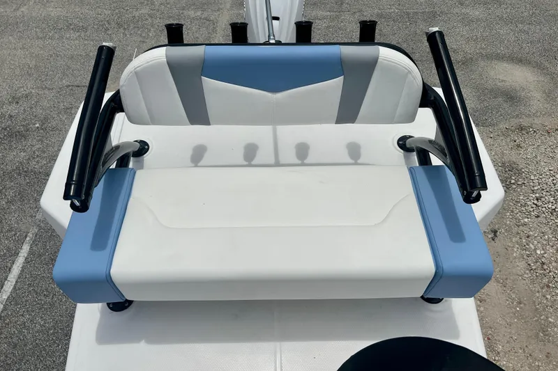 Slide: The Image of 2025 Robalo 266 Cayman SD boat seat with blue and white upholstery. - 25