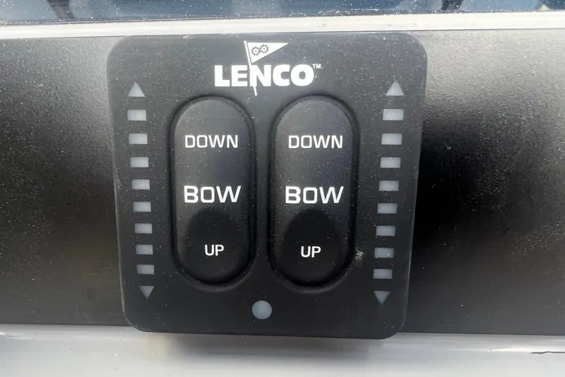 Slide: The Image of Lenco trim tab control panel on 2025 Robalo 266 Cayman SD boat. - 28