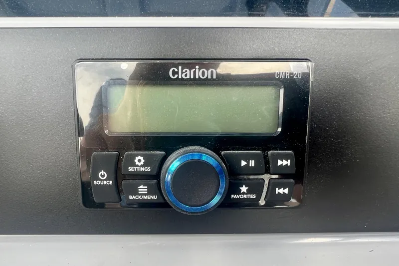 Slide: The Image of Clarion CMR-20 audio system on 2025 Robalo 266 Cayman SD boat dashboard. - 29