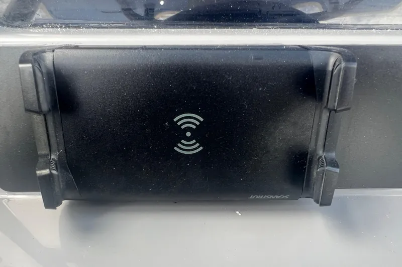 Slide: The Image of Black device with wireless symbol on a 2025 Robalo 266 Cayman SD boat. - 33