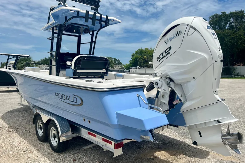 Slide: The Image of 2025 Robalo 266 Cayman SD boat with Yamaha engine on trailer. - 4