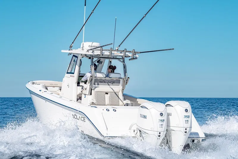 Slide: The Image of Manufacturer Provided Image: 2026 Solace 30 CS boat cruising on open water with dual Yamaha engines. - 1