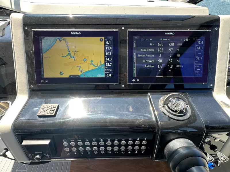 Slide: The Image of Dashboard of 2024 Cruisers Yachts 42 GLS Outboard with dual Simrad displays. - 20