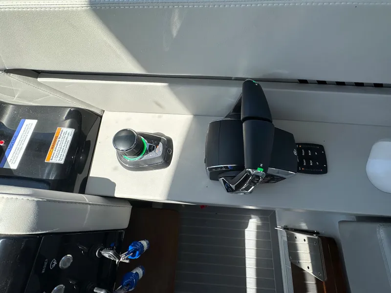 Slide: The Image of Control panel of 2024 Cruisers Yachts 42 GLS Outboard with joystick and throttle. - 21