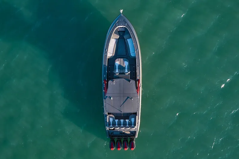 Slide: The Image of Aerial view of 2020 Midnight Express 37 Open boat on calm green water. - 4