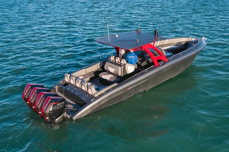 Slide: The Image of 2020 Midnight Express 37 Open boat with quad engines on blue water. - 6