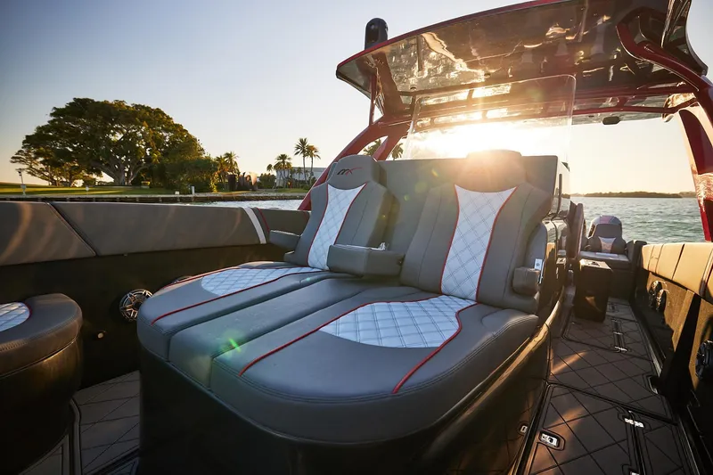 Slide: The Image of Luxurious seating on a 2020 Midnight Express 37 Open boat at sunset. - 9