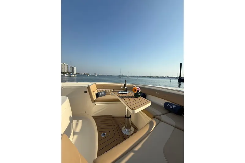 Slide: The Image of Luxurious 2024 Scout 400 LXF boat interior with elegant seating and scenic waterfront view. - 4