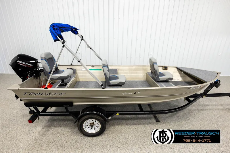 The Image of 1999 Tracker Pro Deep V-16 boat with Mercury engine on trailer, indoor display. - 1