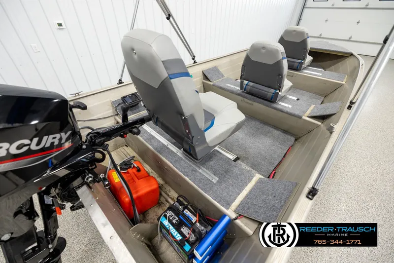 Slide: The Image of 1999 Tracker Pro Deep V-16 boat interior with Mercury engine and seating arrangement. - 11