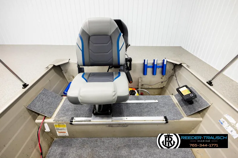 Slide: The Image of 1999 Tracker Pro Deep V-16 boat interior with seat and control panel. - 17
