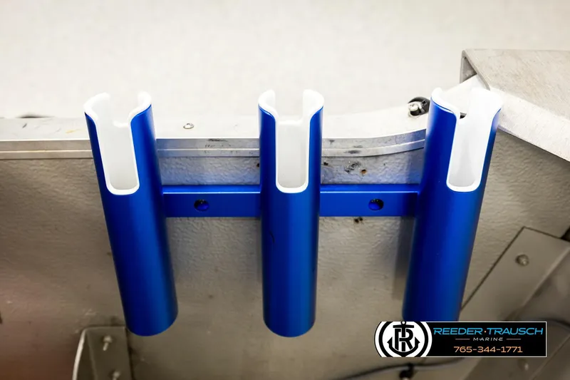 Slide: The Image of Blue rod holders on a 1999 Tracker Pro Deep V-16 boat by Reeder-Trausch Marine. - 18