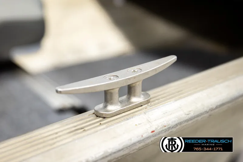 Slide: The Image of 1999 Tracker Pro Deep V-16 boat cleat, close-up view, Reeder-Trausch Marine logo visible. - 28