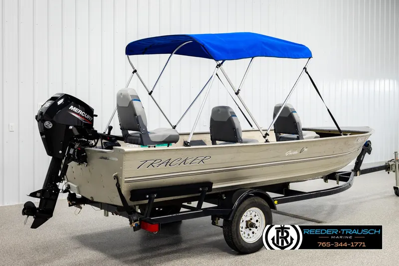 Slide: The Image of 1999 Tracker Pro Deep V-16 boat with blue canopy and Mercury outboard motor. - 5