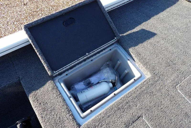 Slide: The Image of Storage compartment in 2025 Crestliner XF 189 boat, containing safety equipment. - 11