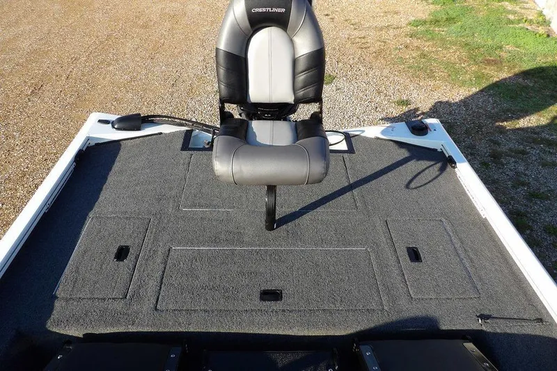 Slide: The Image of 2025 Crestliner XF 189 boat interior with swivel seat on carpeted deck. - 13
