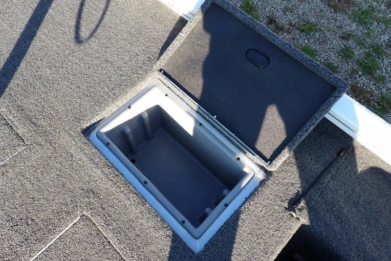 Slide: The Image of Open storage compartment on 2025 Crestliner XF 189 boat deck. - 15